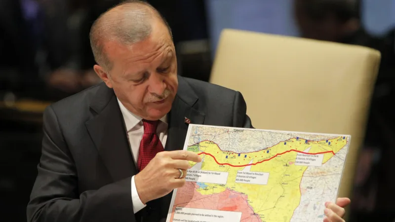 Turkey's President Recep Tayyip Erdogan holds up a map as he addresses the 74th session of the United Nations General Assembly at U.N. headquarters in New York City, New York, U.S.