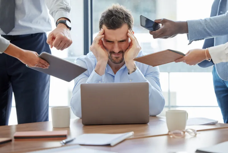 multitasking-stress-man-overwhelmed-office-with-headache-burnout-accountant-audit-financial-taxes-time-management-anxiety-frustrated-by-challenge-with-schedule-deadline (1)