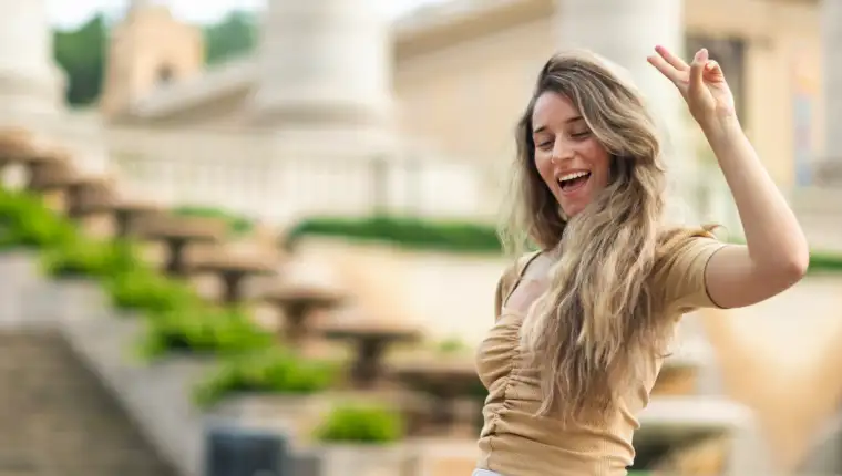 Happy caucasian woman in dress with view of Barcelona