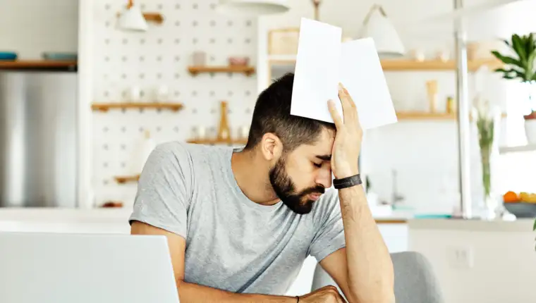 laptop man computer home tired young headache business problem study worried stress reading