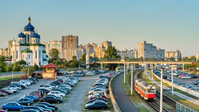 Cathedral of the Holy Trinity and a light rail tram in Troieshchyna - Kiev, Ukraine