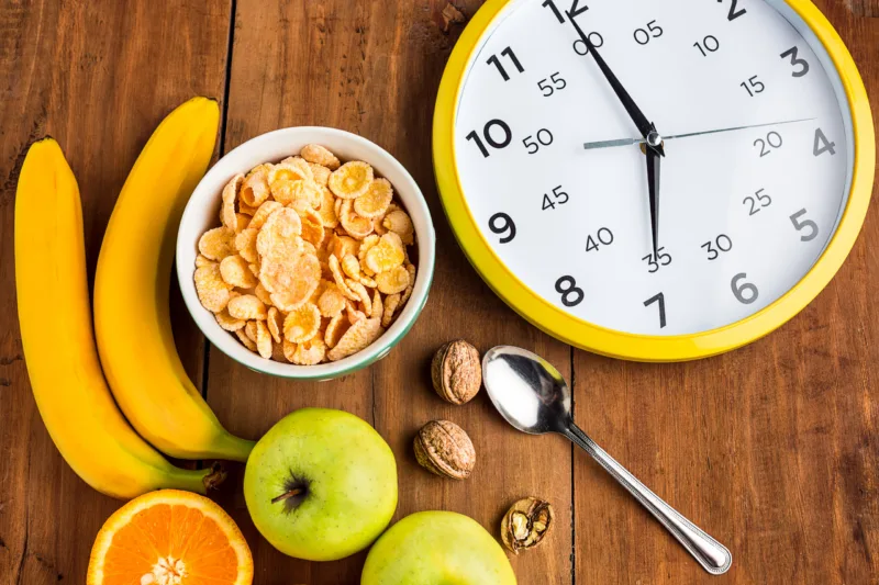 Healthy home made breakfast of muesli, apples, fresh fruits and walnuts