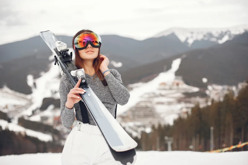 Woman skier in a winter day at a ski resort