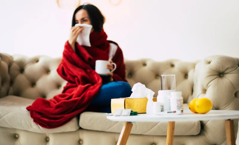 A season flu. Close-up of a coughing girl, suffering from illnes
