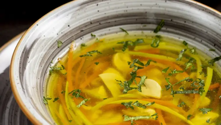 vegetable soup served with greens