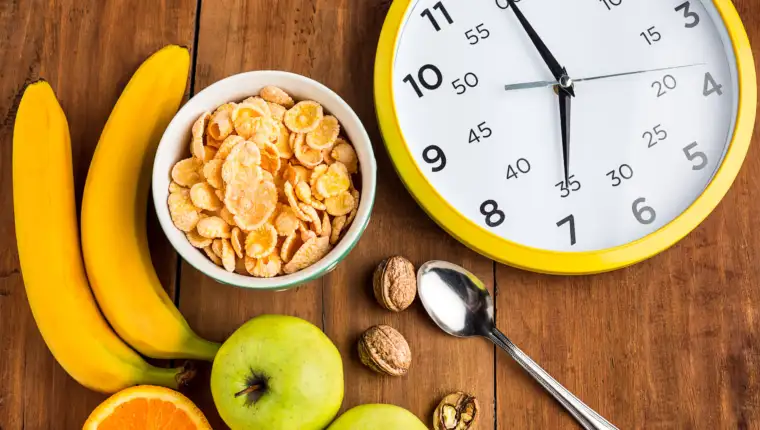 Healthy home made breakfast of muesli, apples, fresh fruits and walnuts