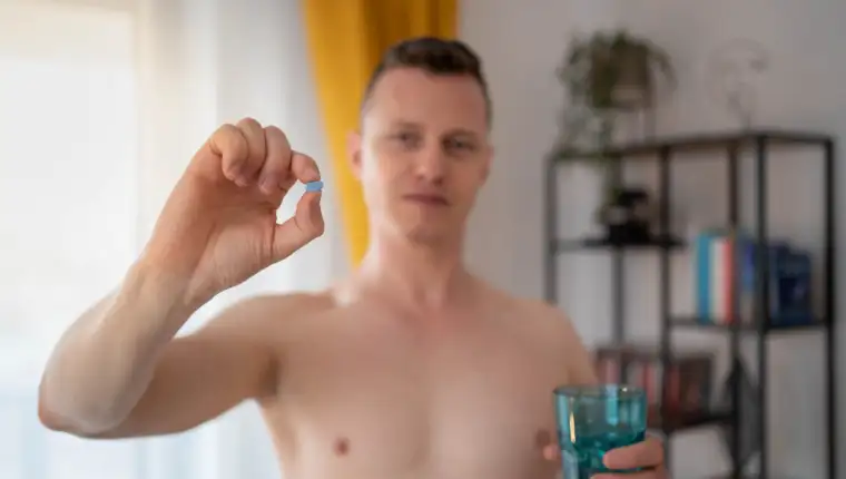 A young man takes a prep in a pill. HIV prevention concept. AIDS prevention concept.