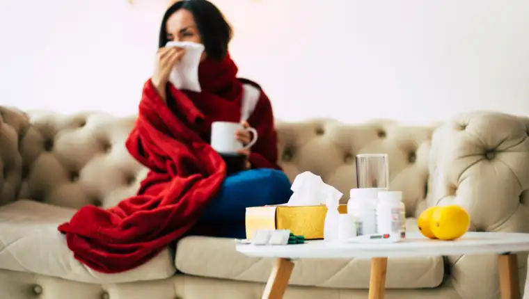 A season flu. Close-up of a coughing girl, suffering from illnes