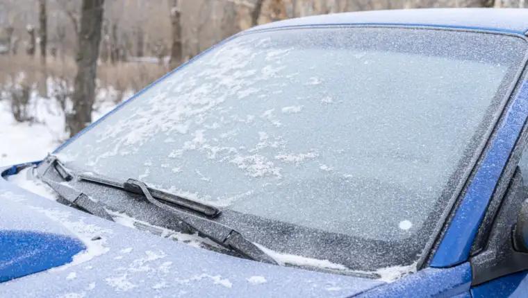 a car window glass under the frozen ice, cold winter problems concept