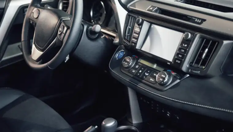 Luxury car Interior - steering wheel, shift lever, dashboard and computer
