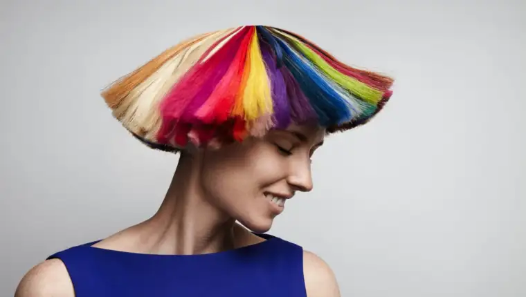 woman shake her rainbow color hair