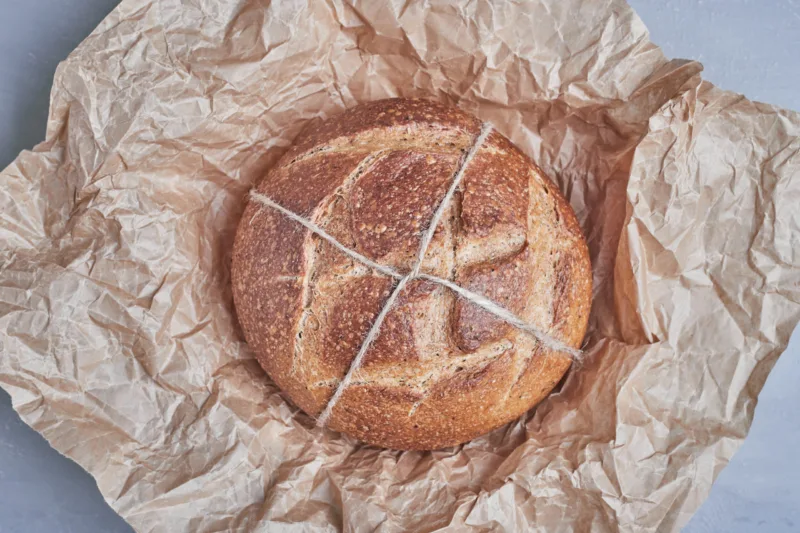 Handmade round bread bun on the paper