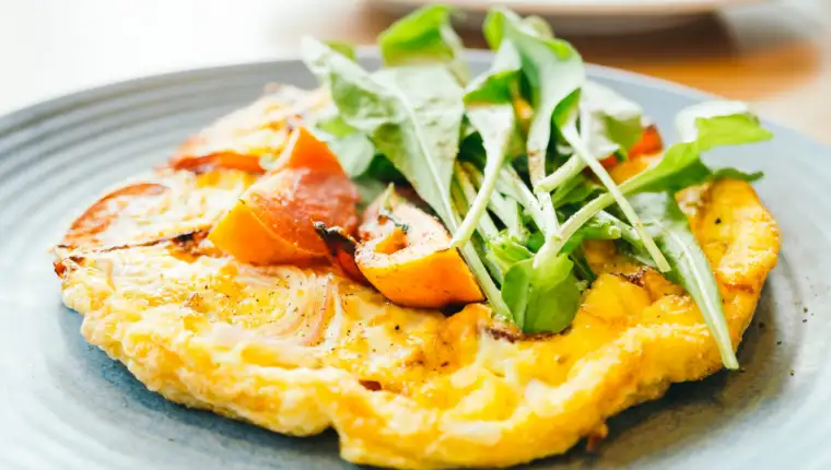 Fried eggs omelette in white plate