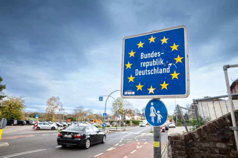 AACHEN, GERMANY - NOVEMBER 8, 2022: Standard EU border roadsign indicating the entrance to Germany (Bundesrepublik Deutschland), at the german border with Netherlands, in the Schengen area.