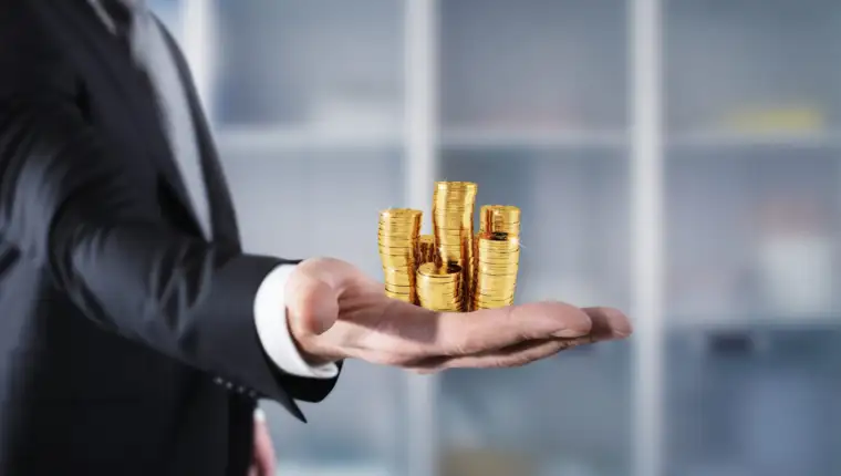 Businessman hold piles of money. Concept of success and company growth