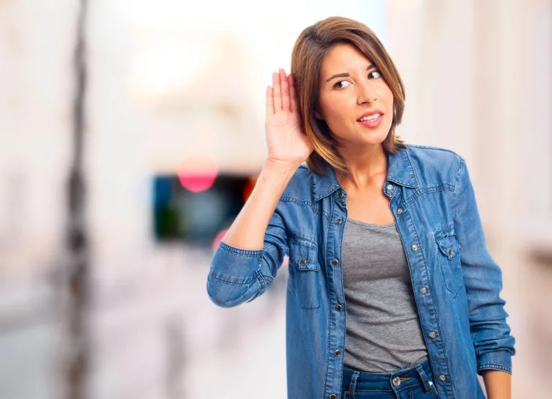 young cool woman trying to listen