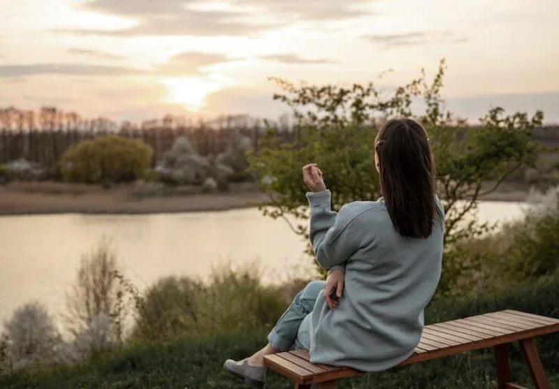 View from back girl looks sunset sitting bench 169016 11745