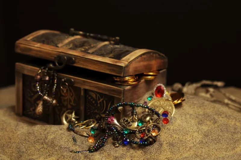 Buried pirates treasure chest 157583040 5b5630f7c9e77c005b40d079