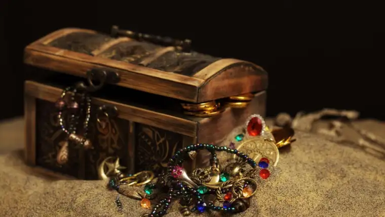Buried pirates treasure chest 157583040 5b5630f7c9e77c005b40d079
