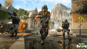 Call of Duty scena iz nove verzije igrice trojica muškaraca dvojica u maskirnoj uniformi sa puškama treći sa zoljom na ulici iza crkva i stijene u magli saobraćajni znak i vatra
