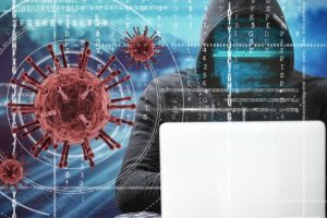 Američka Tajna služba objavila haker za računarom bijelim u crnoj dukserici ne vidi se lice iza koronavirus slika virusa sve zamrljano kodovima slika napravljena kao ilustracija plava pozadina